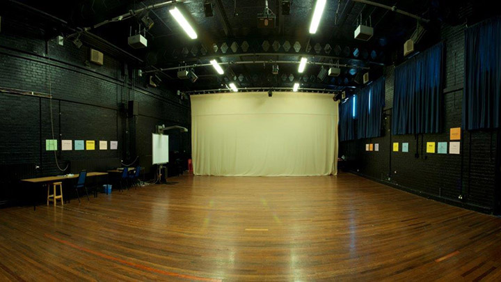 A front view of the stage within the Matthew Bourne Theatre